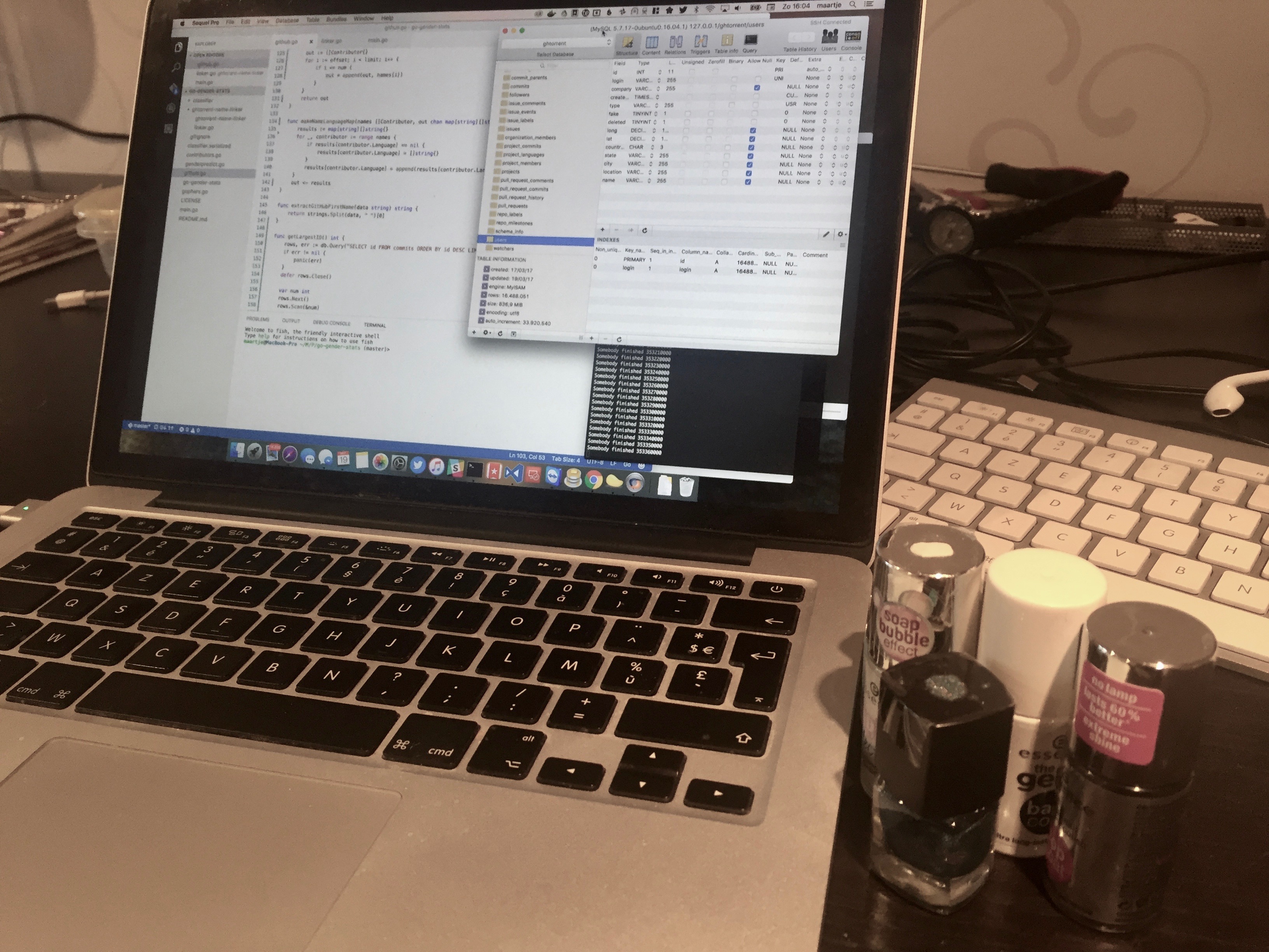 My MacBook accompanied by nail polish bottles